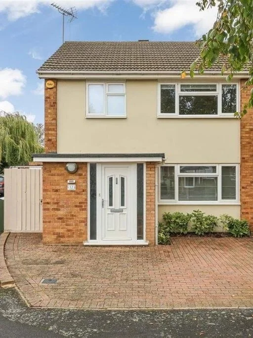 Front door, side gate and parking spot.