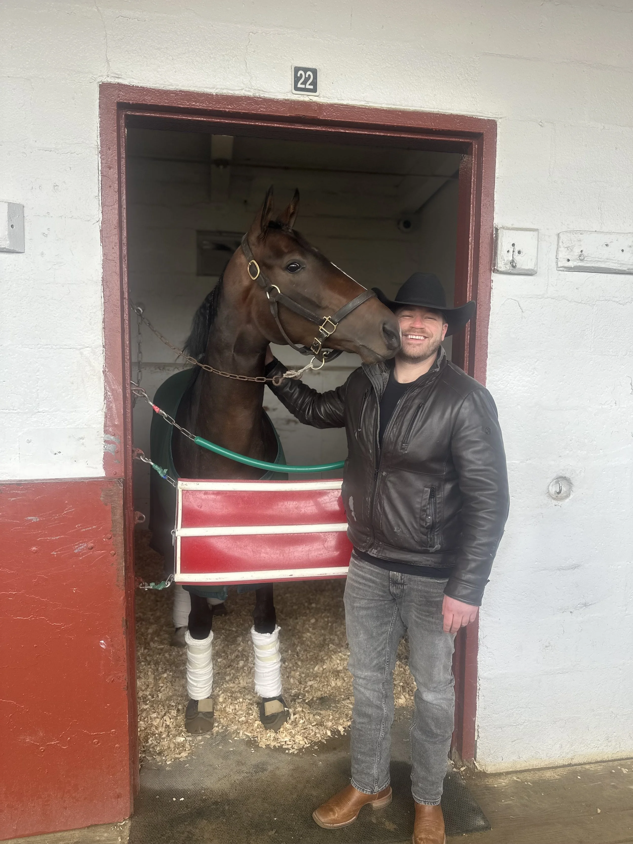 Horse owner in a barn
