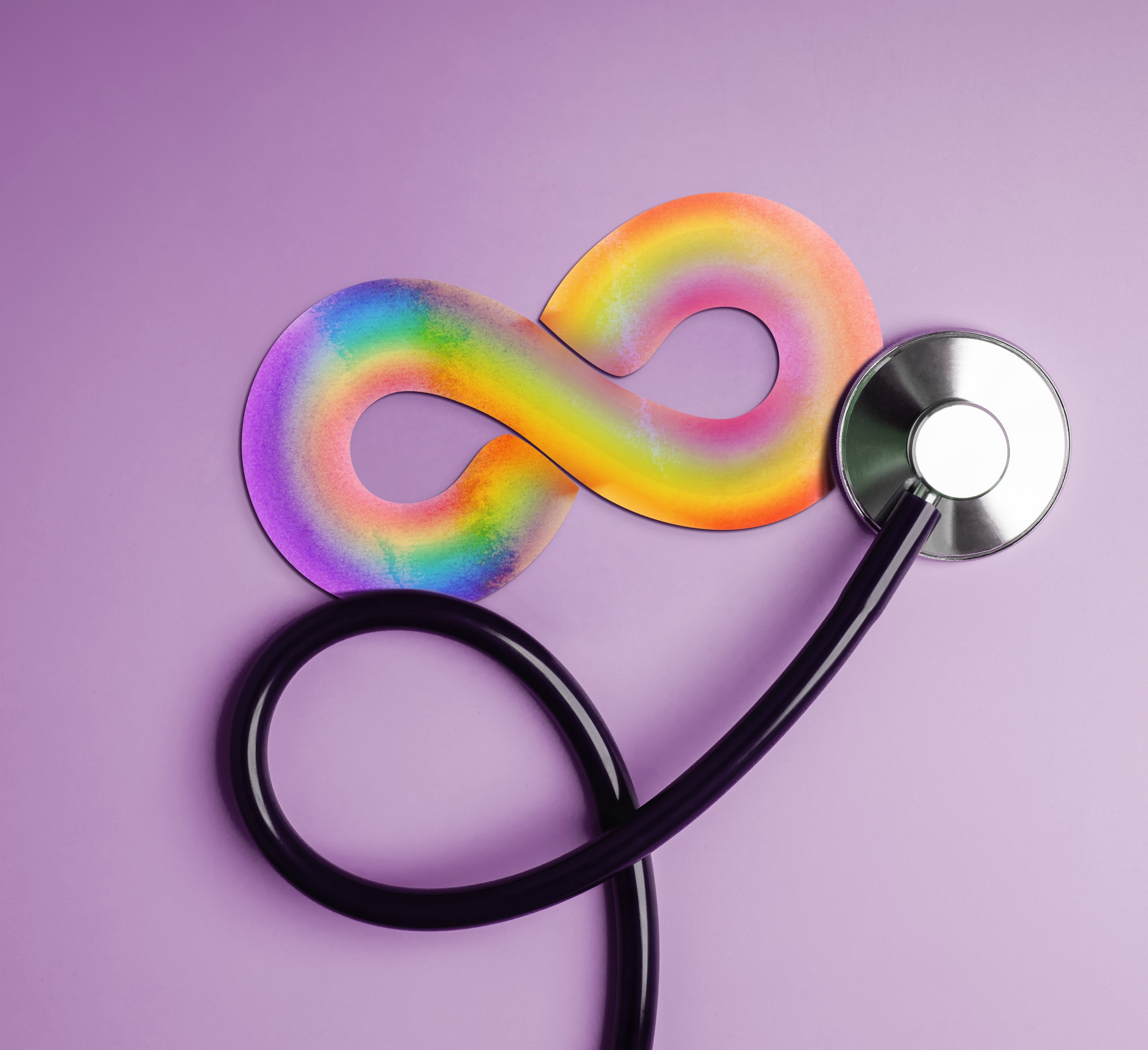 A stethoscope and a rainbow-colored paper chain on a purple background.
