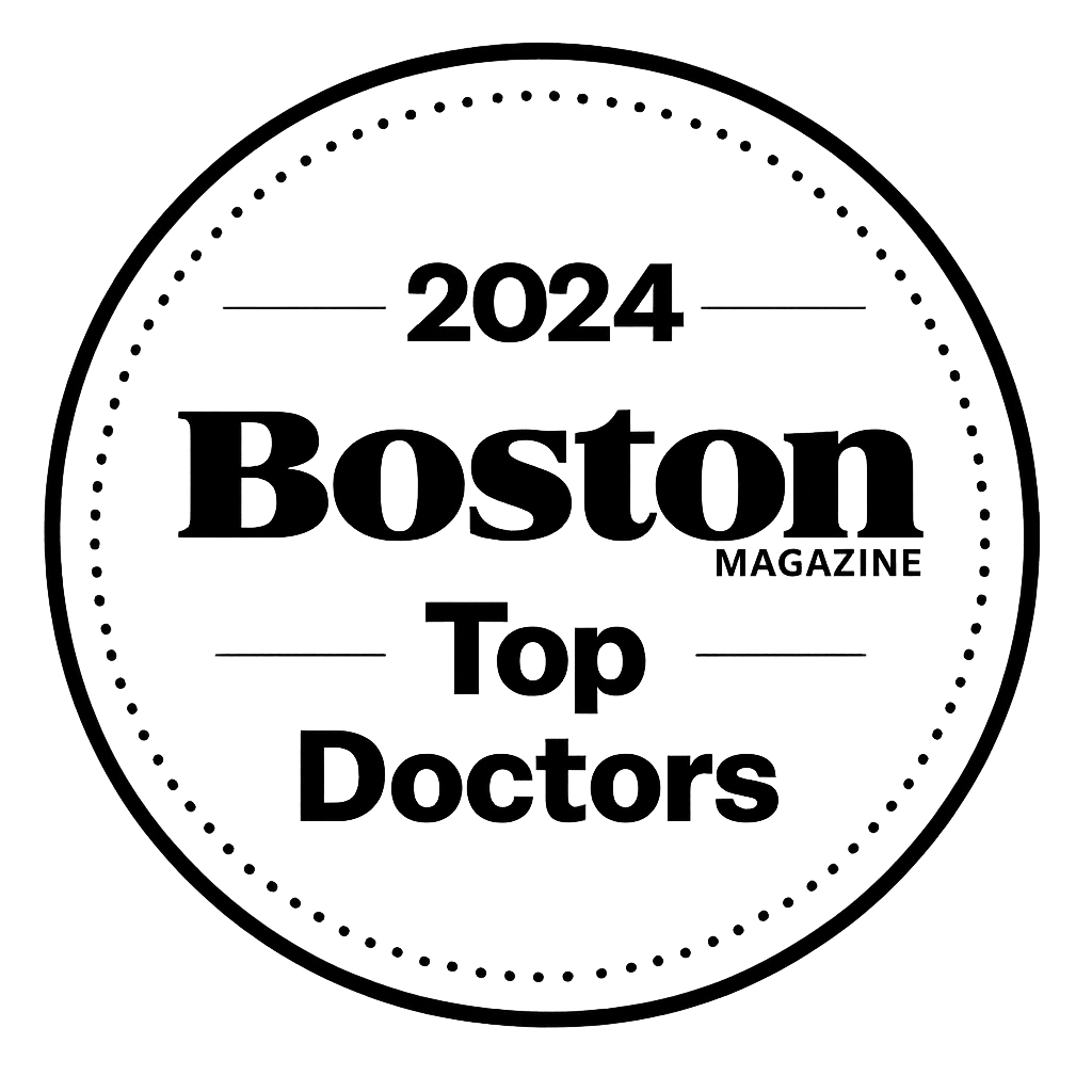 Black and white circular badge with text stating '2024 Boston Magazine Top Doctors'.