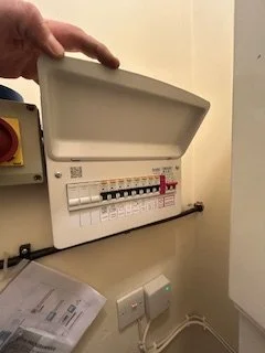 Electrician in Anglesey carrying out electrical installation on a new fuse board