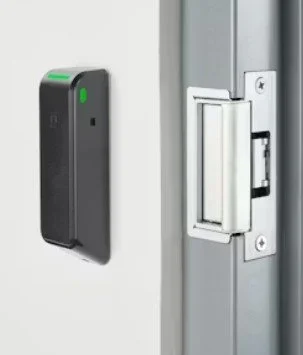 Electric door strike and card reader installed at a controlled entry point for secure access control.