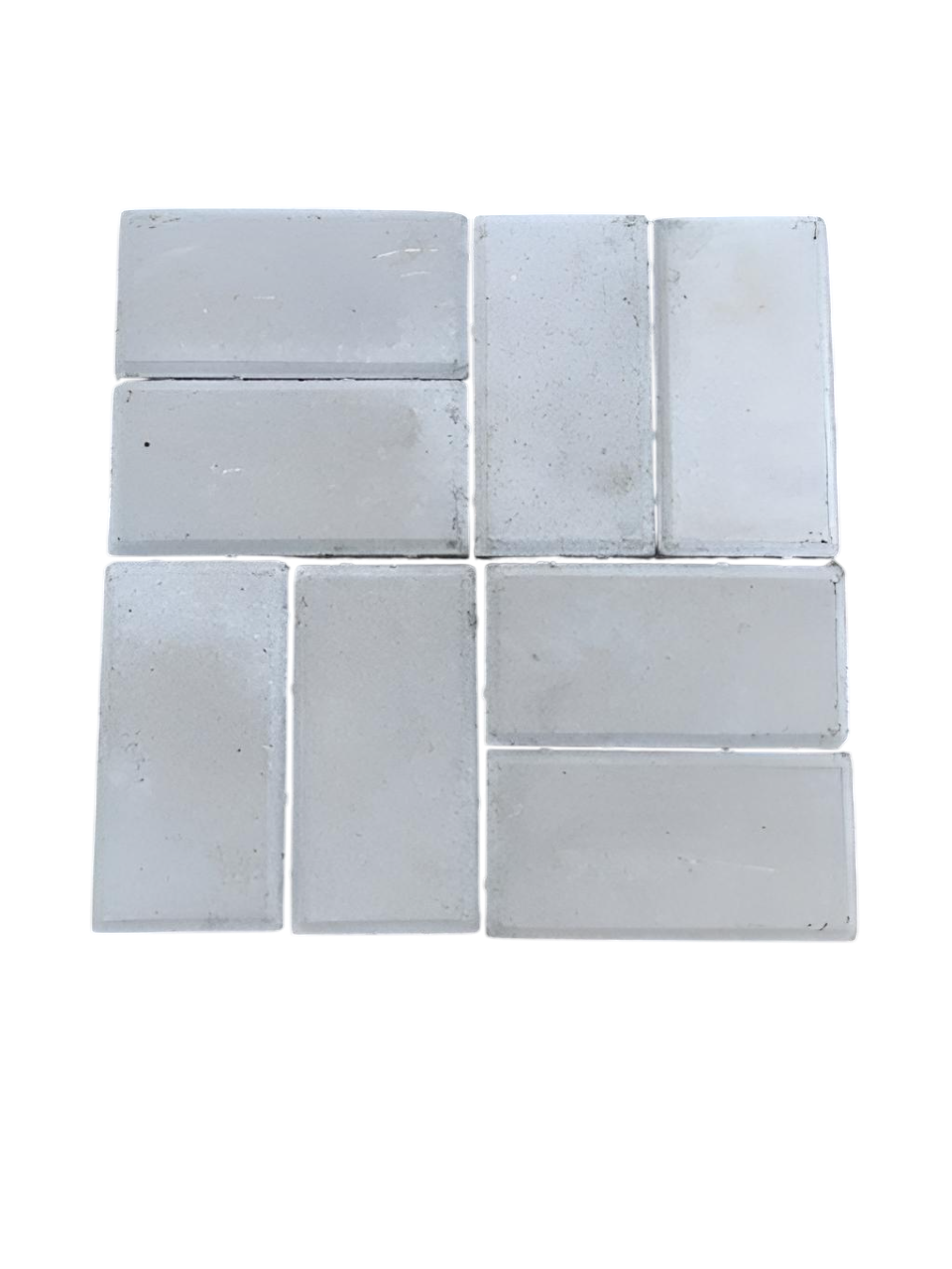 Arranged white ceramic tiles with visible grout lines and some surface imperfections