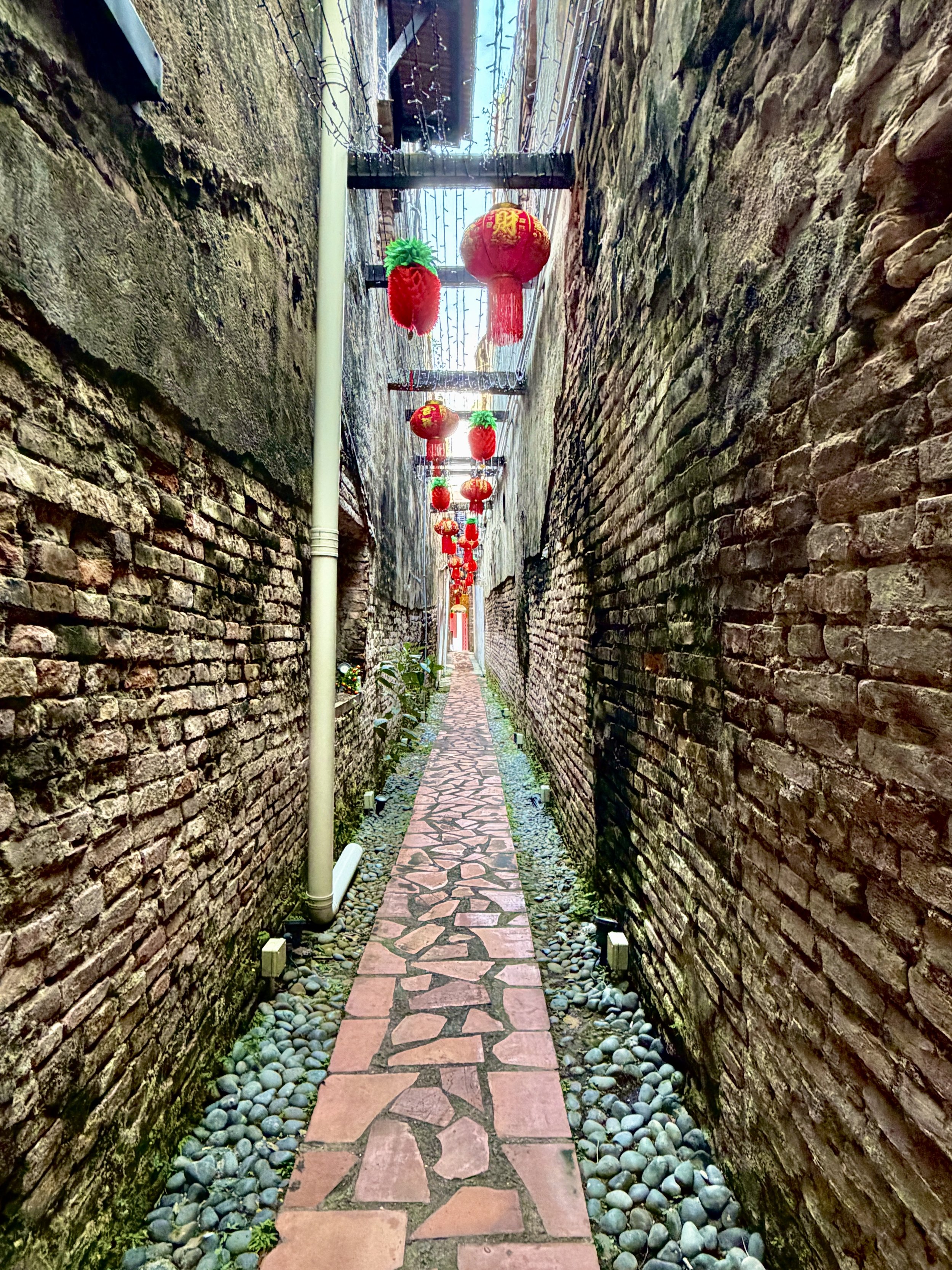 Narrow alleyway between shophouses