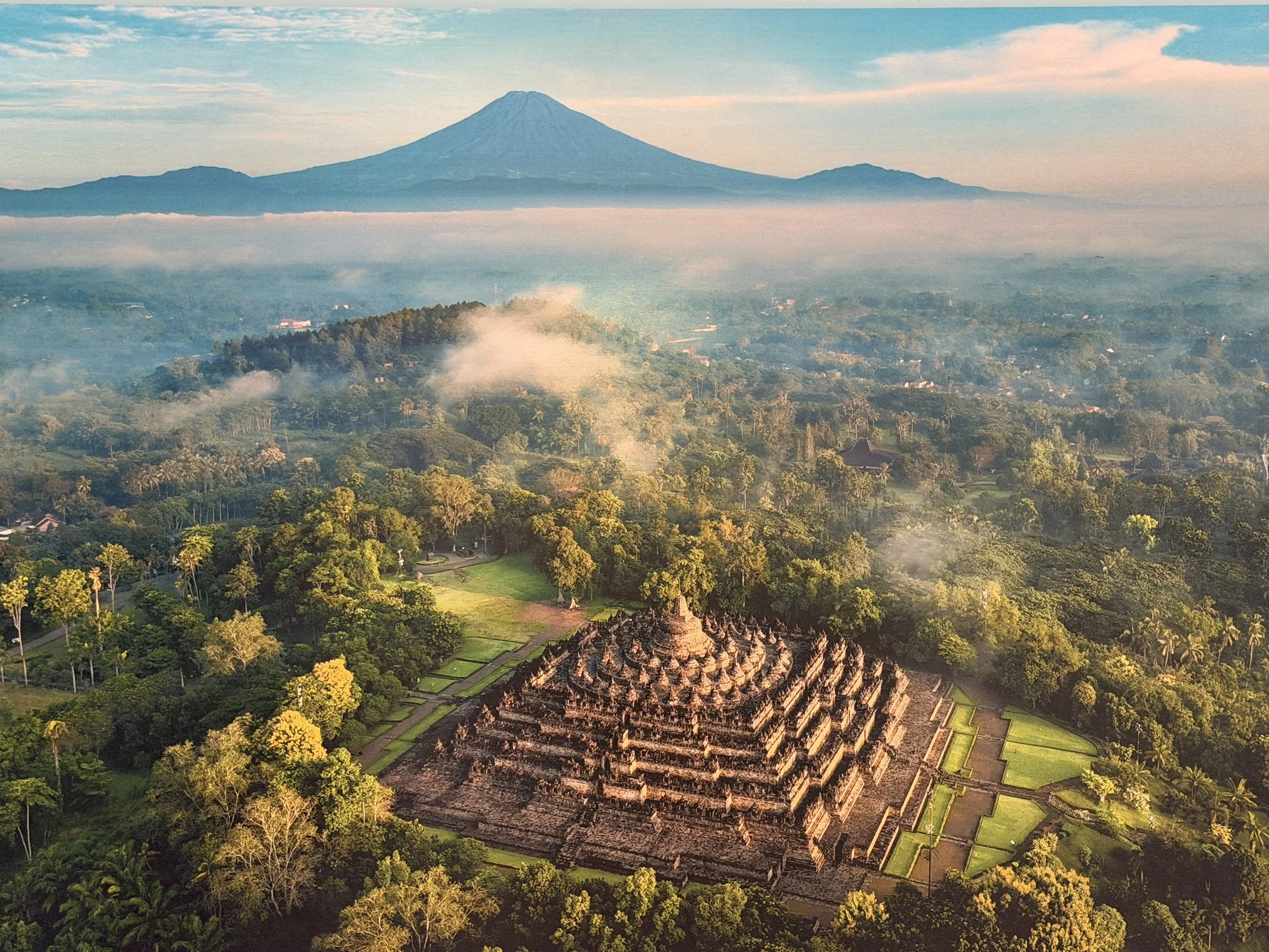 Borobudur Temple with the still very active volcano, Mount Merapi, in backgroudn