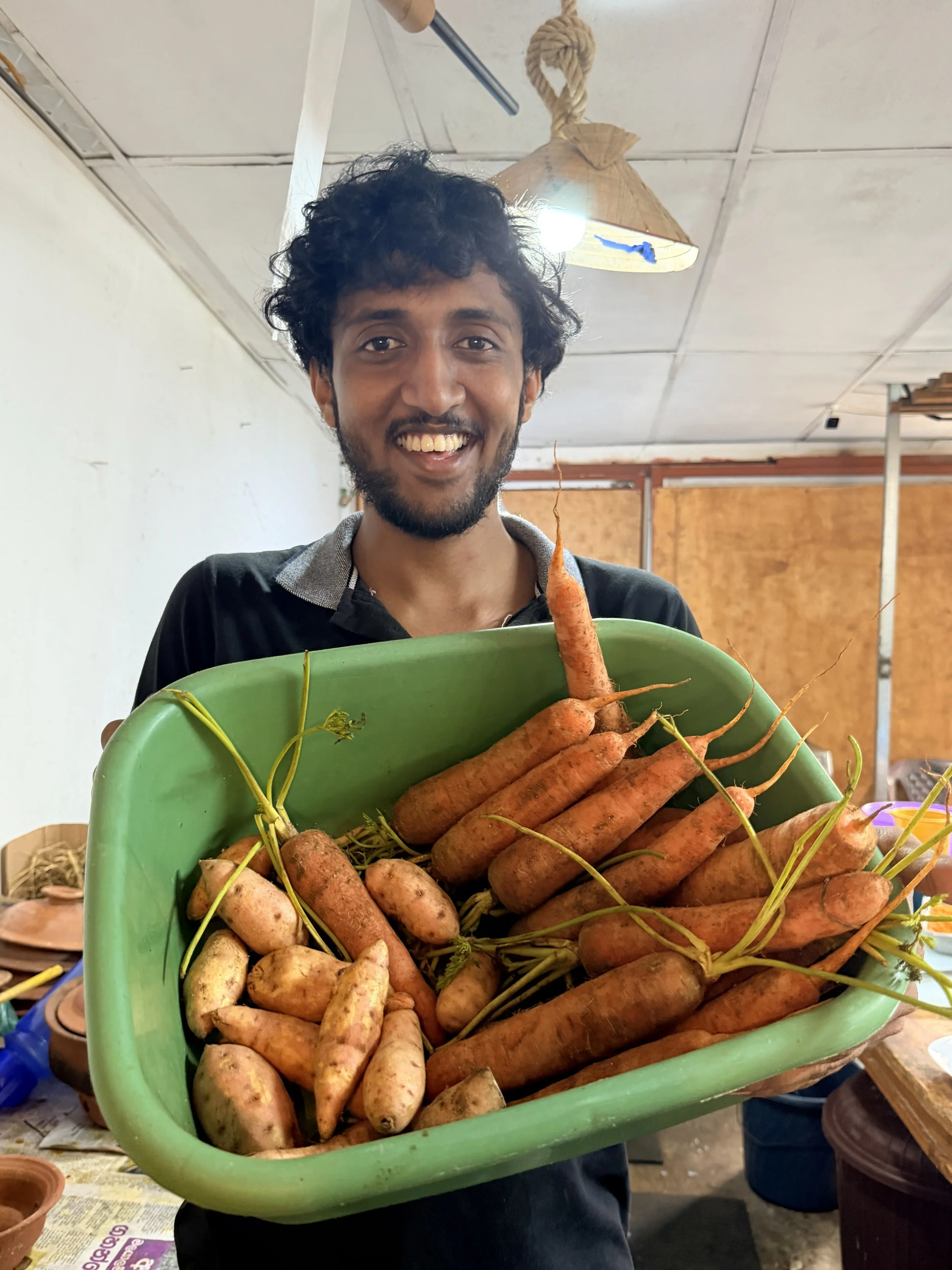 The young man whose famiy restaurant was where we first tried sweet potato chips - and who kindly showed me the sweet potatoes themselves (the ones on the left)