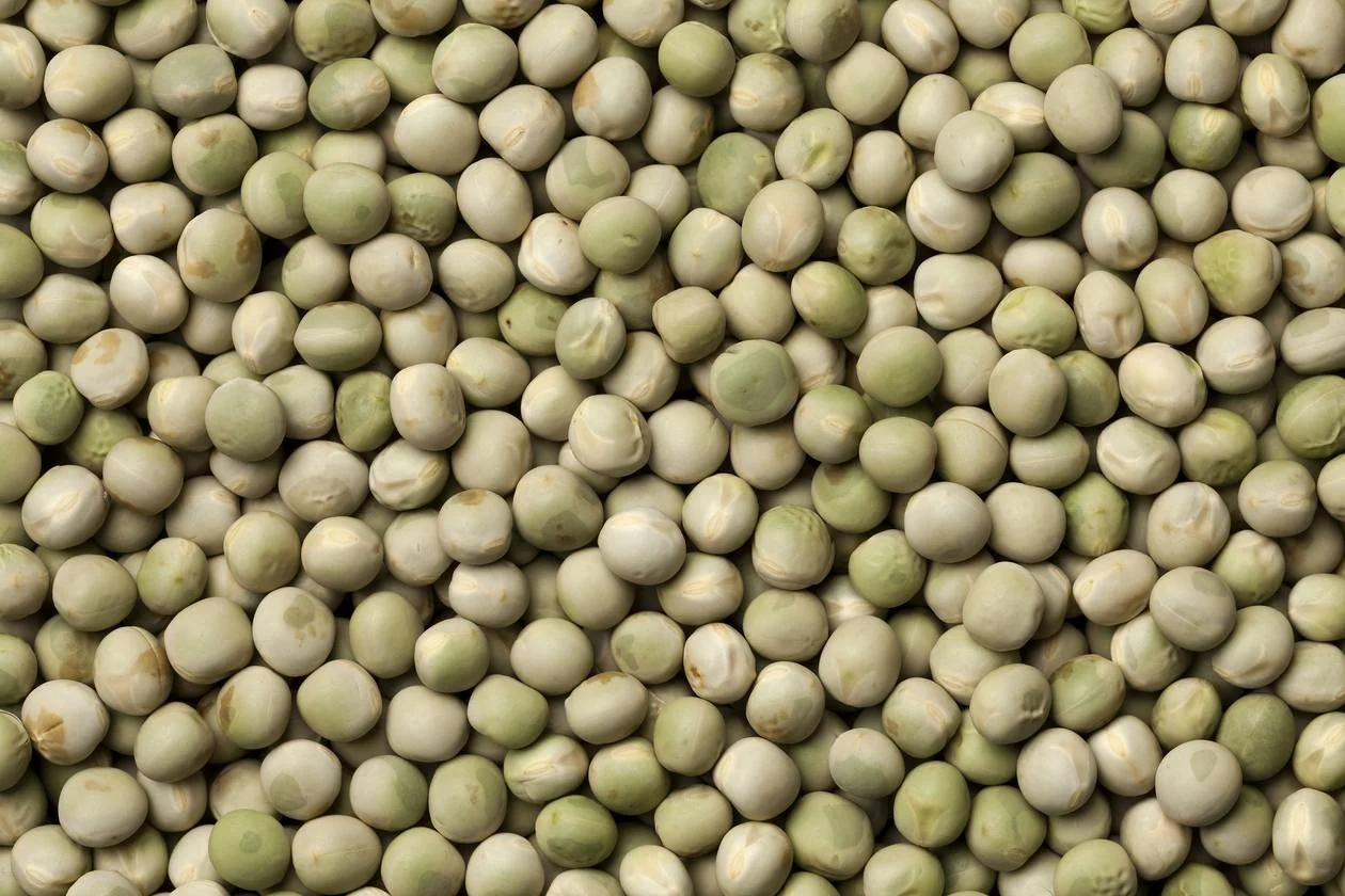 A large pile of dried green peas.