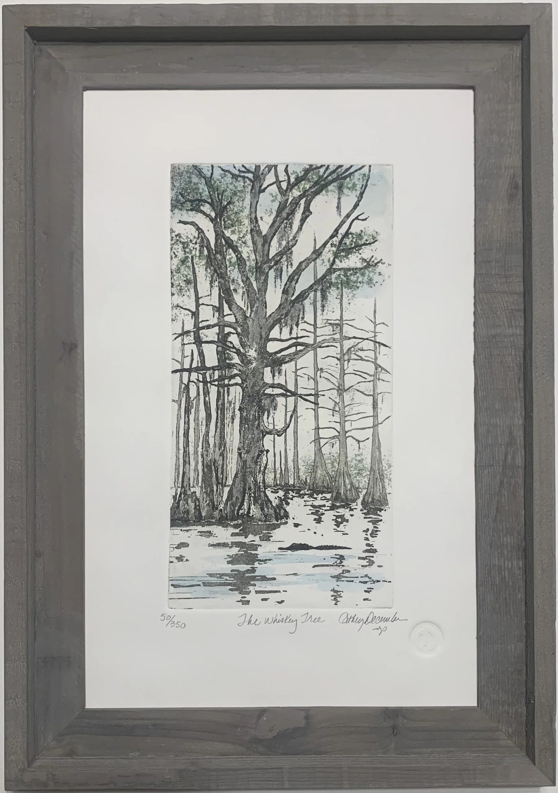 A framed watercolor painting titled 'The Whiskey Tree' depicts a swamp scene with tall trees, some with cypress knees, and water reflecting the landscape.