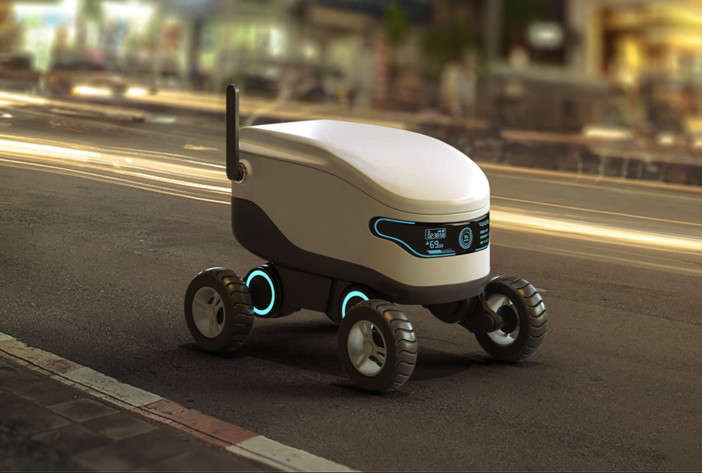 Autonomous delivery robot on city street at night with motion blur of passing cars in background.