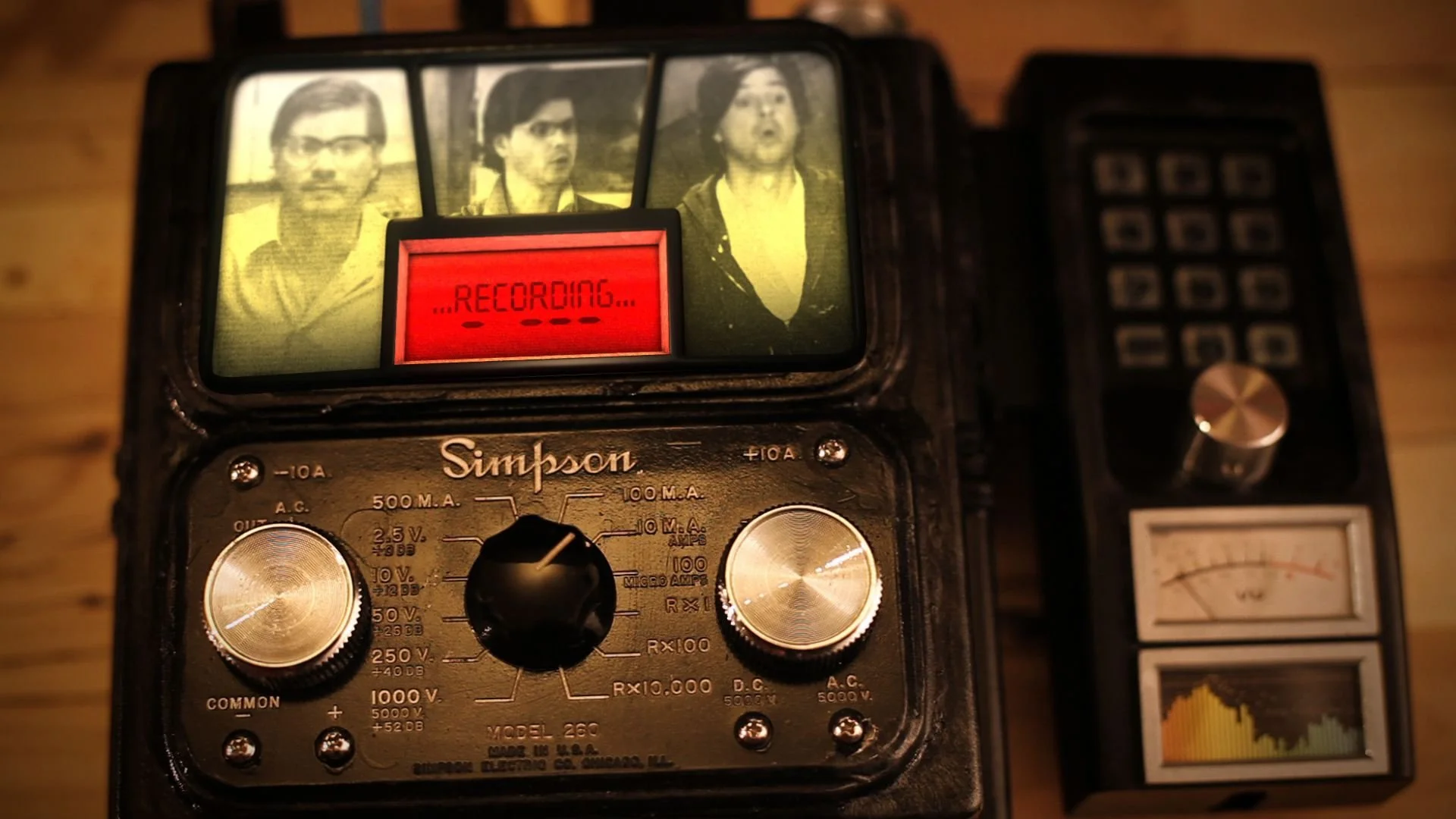 A vintage Simpson radio with a red recording indicator, featuring black and silver dials and switches, positioned next to a modern portable digital radio with a small speaker and buttons.