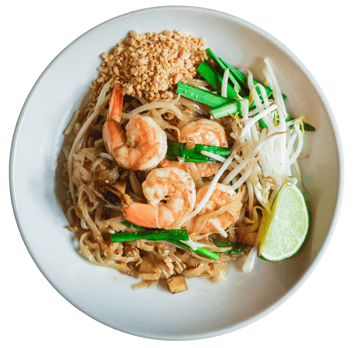 Pad Thai with stir-fried rice noodles, whole shrimp, bean sprouts, chives, and crushed peanuts, served with a wedge of lime.