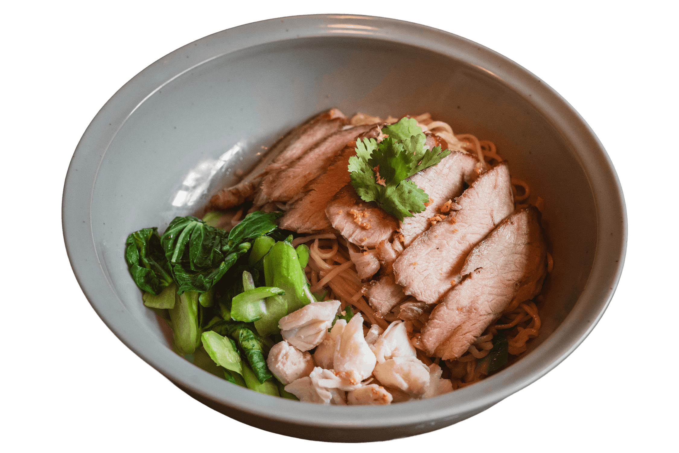 A bowl of Ratchaburi Pork & Dry Crab Noodle topped with yuchoy and garnished with cilantro.