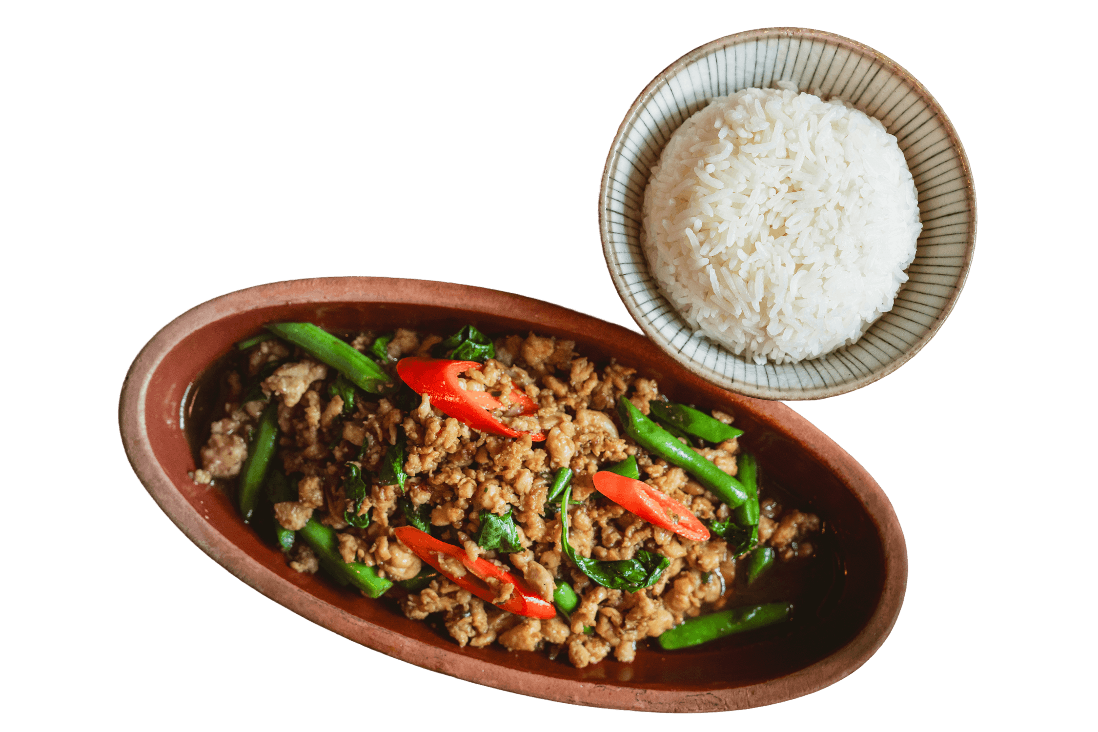On the bottom left is wok Basil stir fry with ground meat, string beans, and red chili in a rustic brown clay bowl and on the top right is a small ceramic bowl of steamed white jasmine rice, served alongside.
