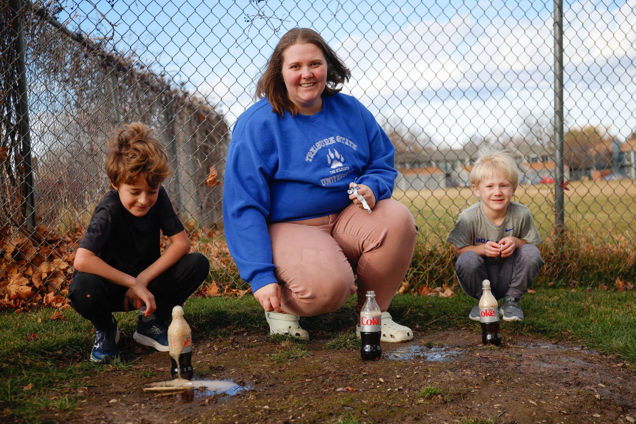 A fox aand Kids instructor playing with kids outside in Boise.