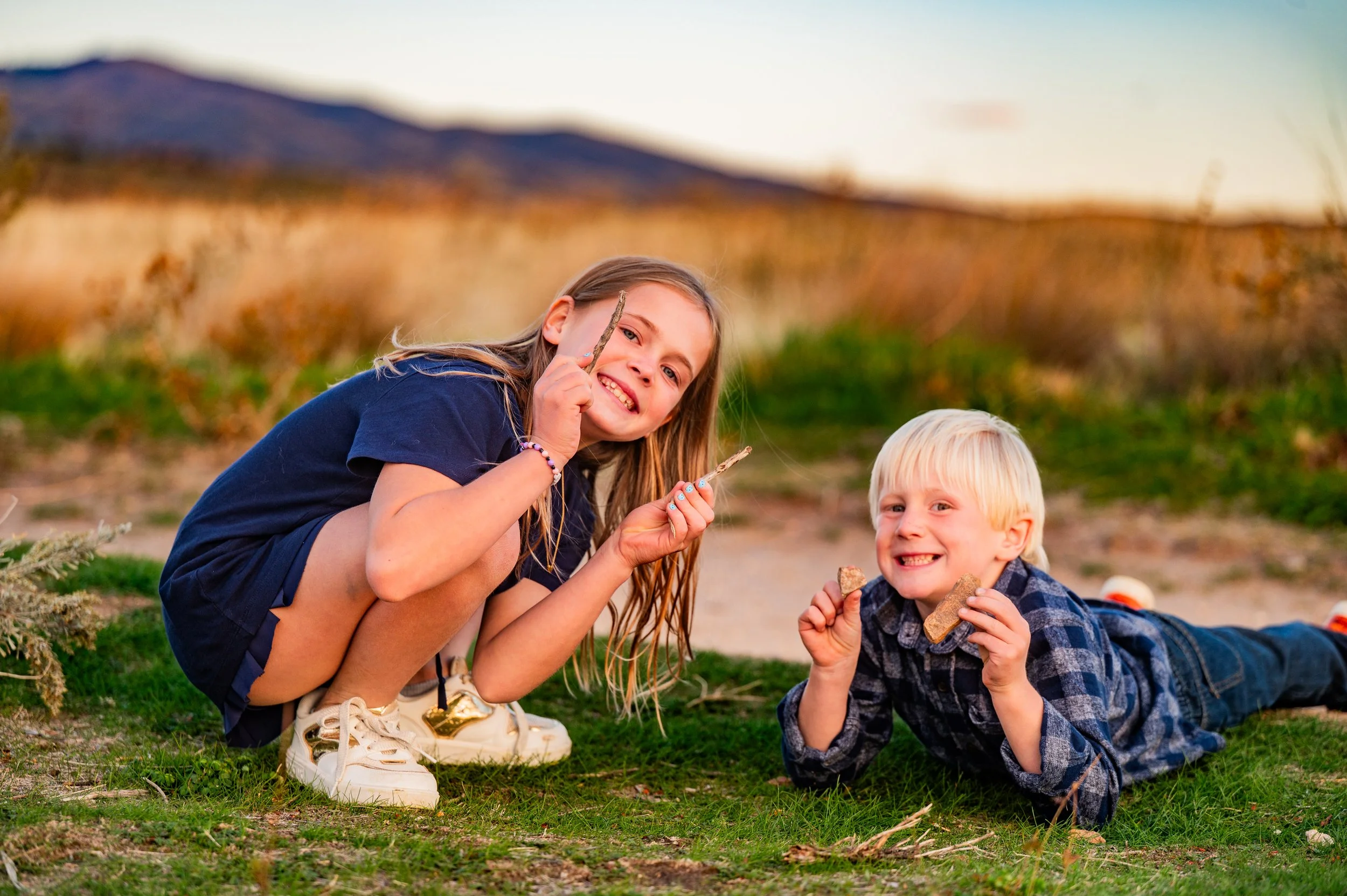 Two kids playing outside together.
