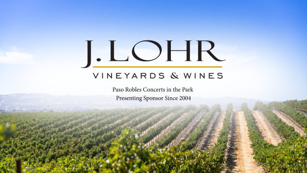 Vineyard landscape with rows of grapevines and a blue sky, promoting J. Lohr Vineyards & Wines, Paso Robles Concerts in the Park, sponsoring since 2004.
