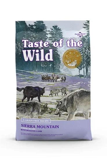 Package of wild game dog food labeled "Taste of the Wild," featuring illustrations of wild animals like bears, wolves, and deer in a forest setting.