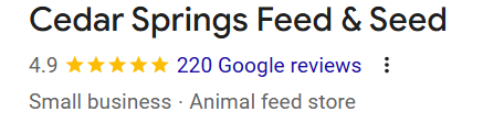 Screenshot of Cedar Springs Feed & Seed business listing with 4.9 star rating based on 220 Google reviews, categorized as small business and animal feed store.