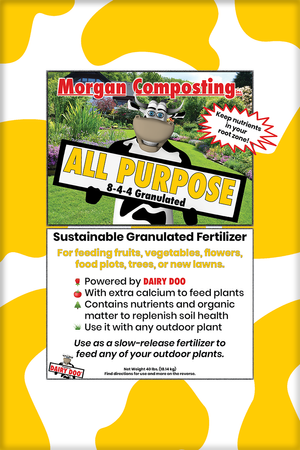 Bag of Morgan Composting All Purpose Granulated Fertilizer with a green and white label, featuring a cartoon cow, an outdoor garden scene, and text describing the fertilizer's uses and benefits.