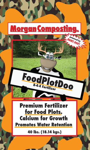 A cartoon reindeer holding a sign that reads "FoodPlotDoo" with the slogan "8-44 Fertilizer." The background is green grass, and the image is framed with a camouflage pattern. The top banner says "Morgan Composting," and there's a red starburst with the text "Powered by DAIRY POO!" The brochure promotes a fertilizer product for food plots, highlighting calcium for growth and water retention, weighing 40 lbs.