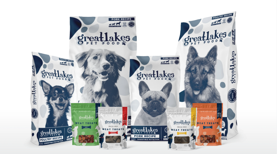 Various bags of pet food and treats from Great Lakes Pet Food, featuring images of dogs on the packaging.