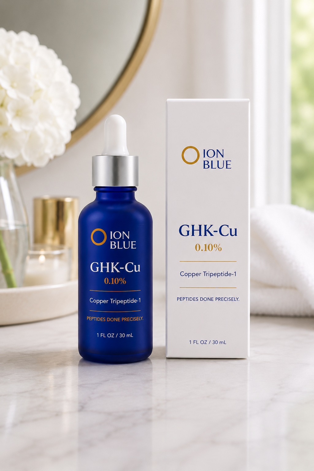 ION BLUE GHK-Cu 0.10% copper peptide serum and box on a marble vanity — Copper Tripeptide-1, Peptides Done Precisely.
