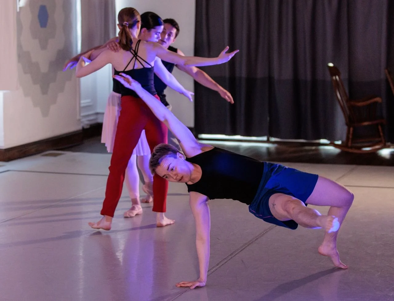 Four dancers strike a pose in the Harrisonburg Dance Cooperative studio.
