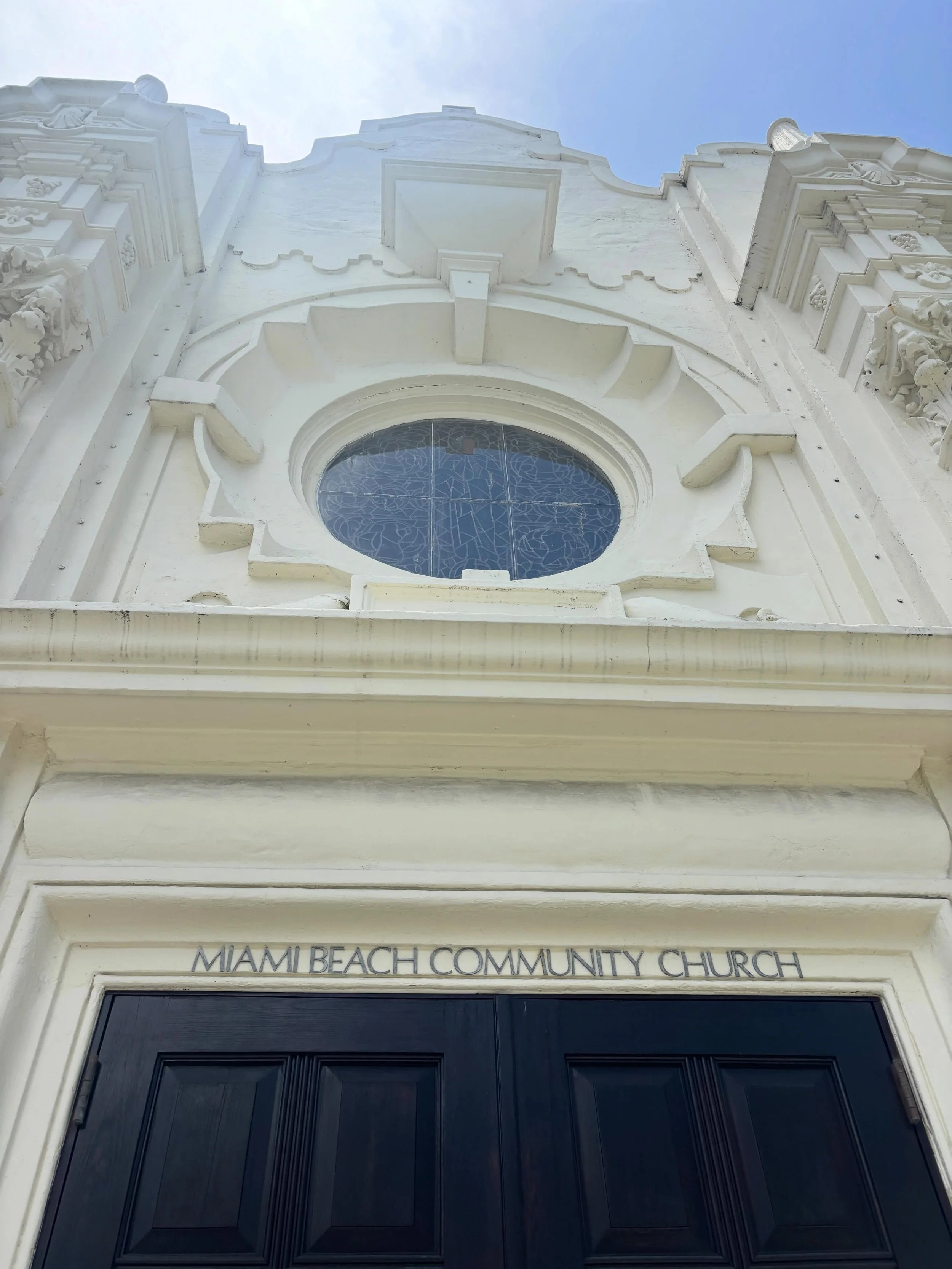 This weekend I found myself looking up.

At shell carvings weathered by salt air. Circular windows that feel more sculpture than architecture. Tropical foliage growing wild beside century-old buildings. A staircase detail. A stained-glass window. A l