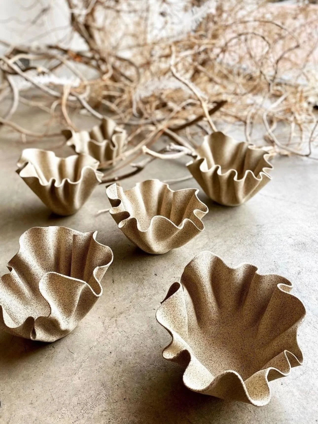 One of the best parts of building White Palm Home has been meeting  artists whose work feels both beautiful and a little unexpected.

Janna, the ceramic artist behind Curious Clay, creates pieces that blur the line between art and function. Her work 