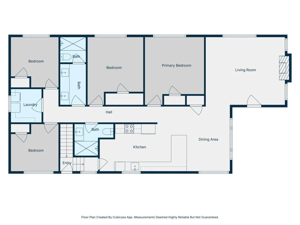 Floor plan of a house with bedrooms, bathrooms, kitchen, living room, dining area, laundry, hall, and entry.