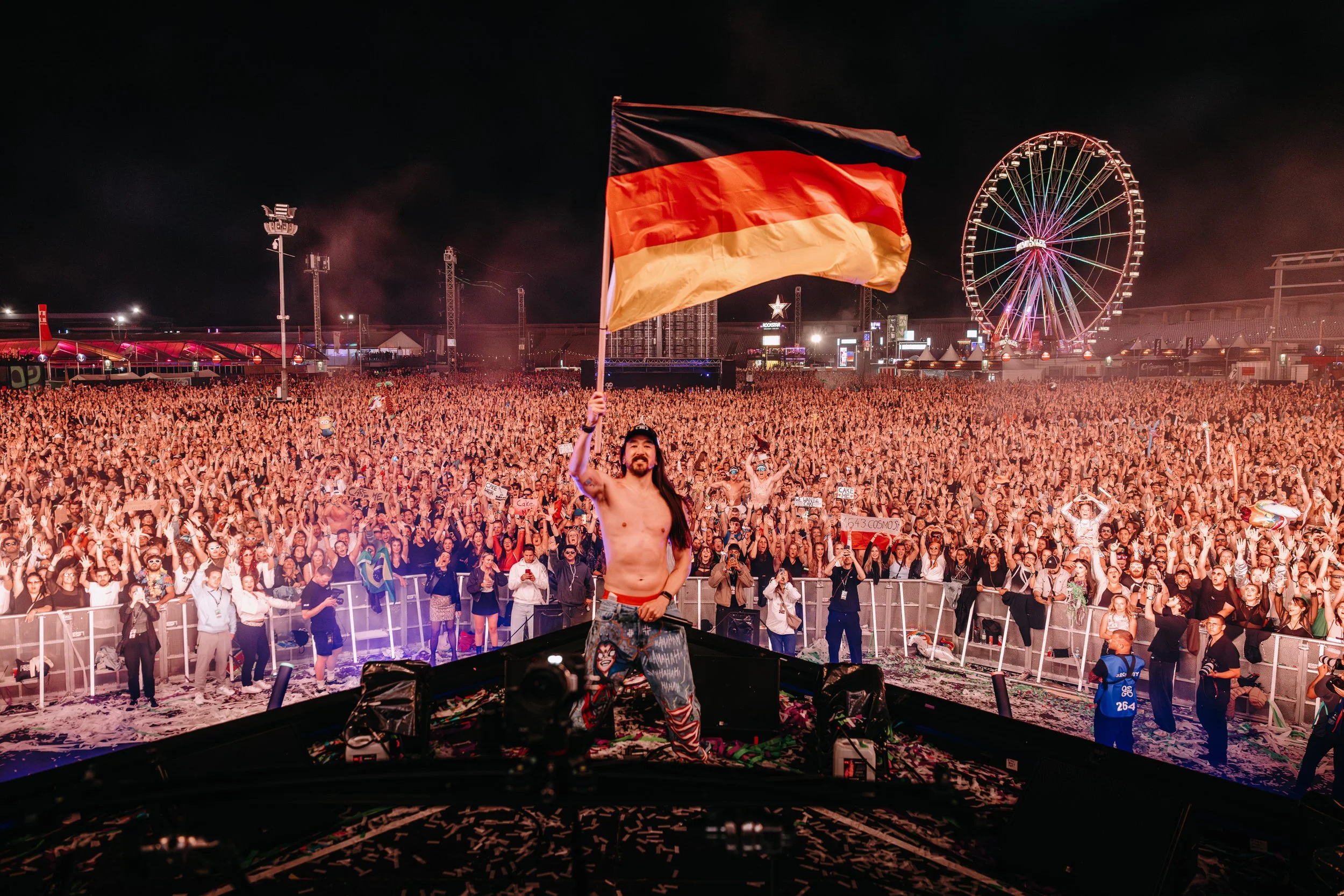 Steve Aoki at a Germany Festival taking a group Photo by James Bridle Music Photographer
