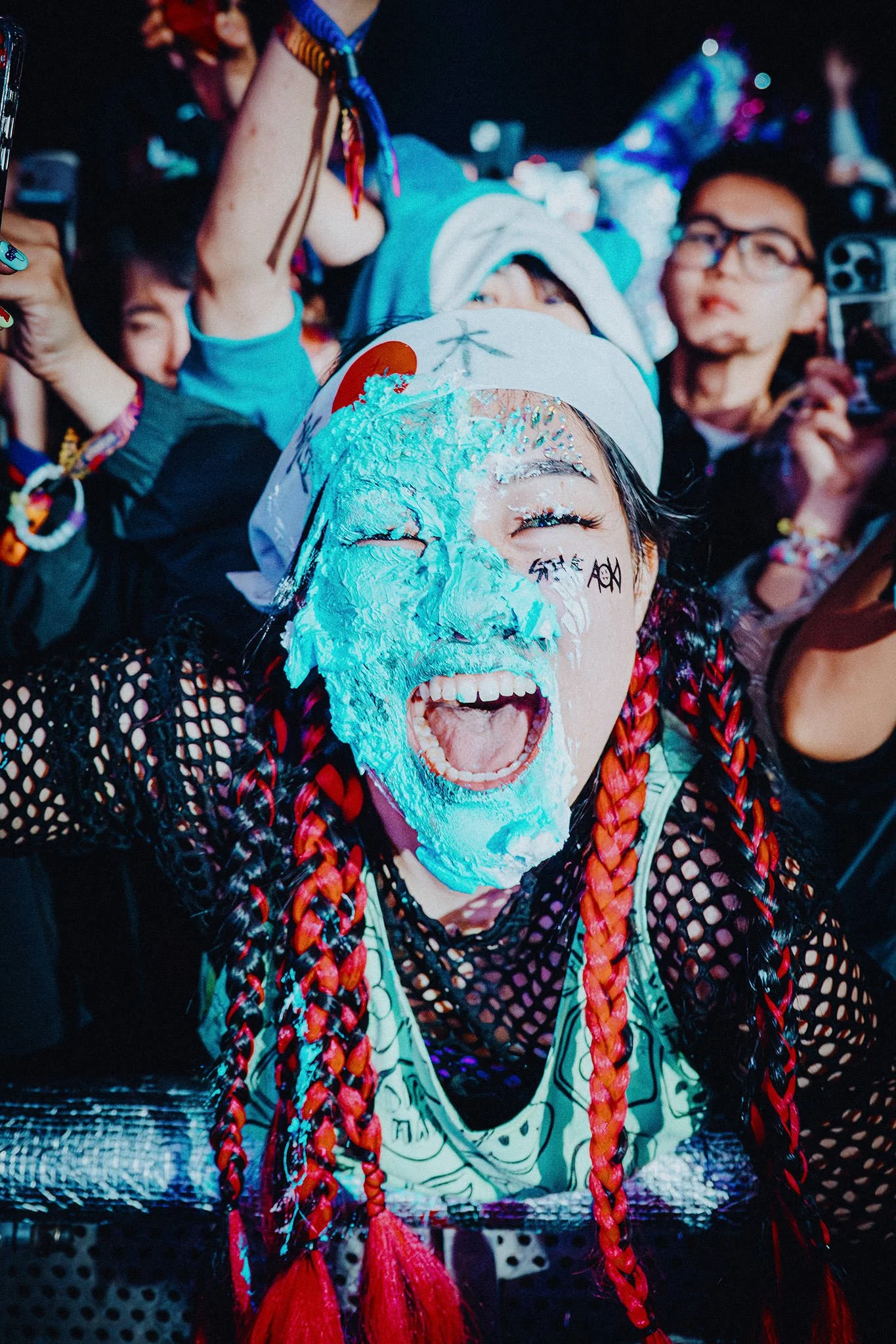 Festival Goer EDC South Korea Caked by Steve Aoki. Captured by James Bridle Music Photographer.