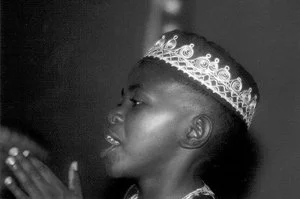 Alex toured the USA, UK, and Canada with the African Children's Choir from 1997 - 2000