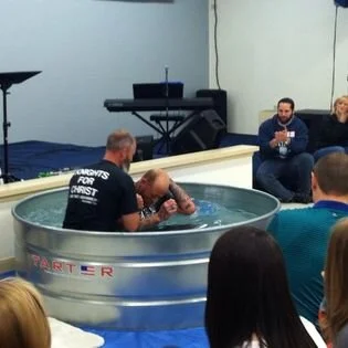 Fred being baptized
