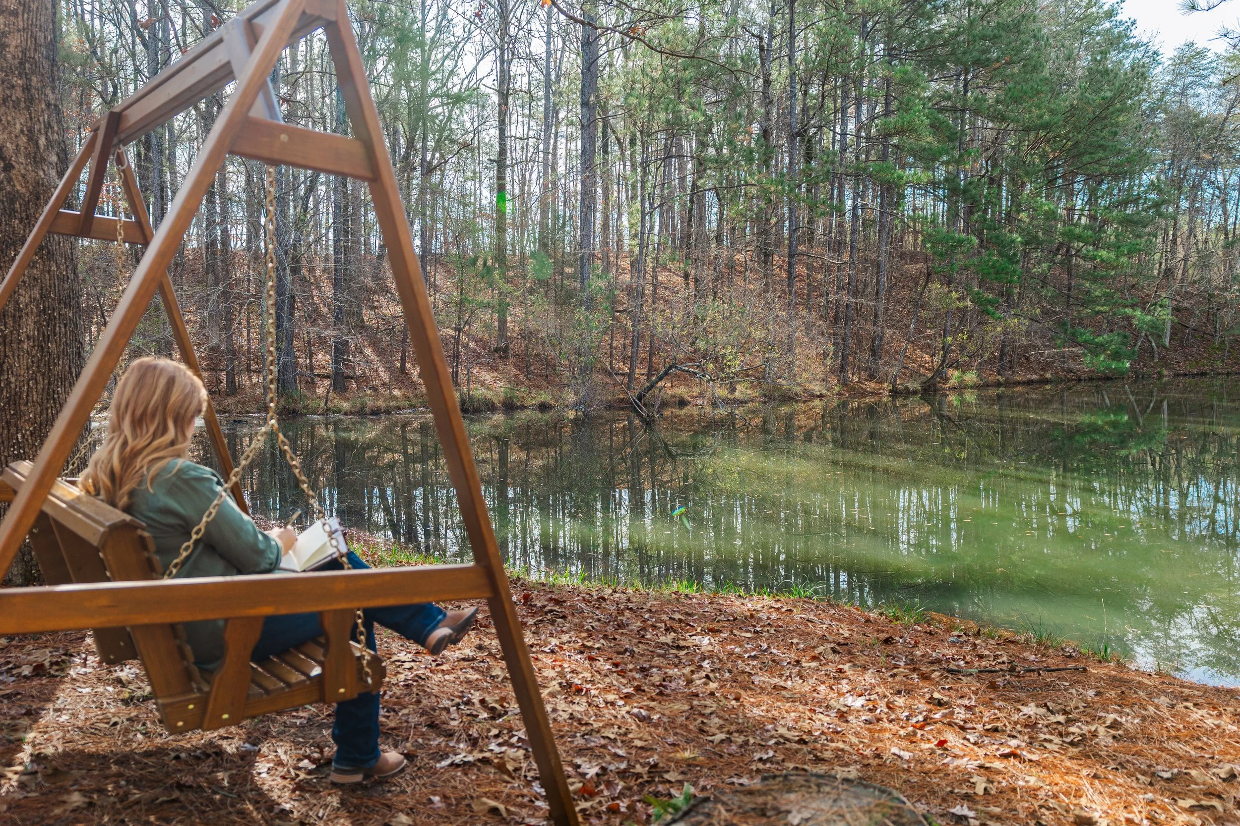 Certified LifePlan Guide Deidre King reflecting outdoors in a quiet Alabama woodland environment.