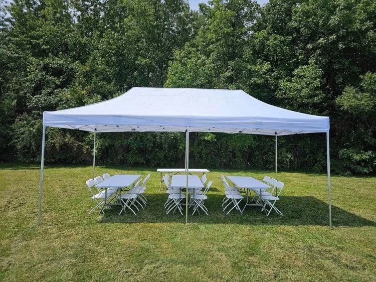 10x20 tent covering 6 foot tables and folding plastic chairs. All rentals for parties party