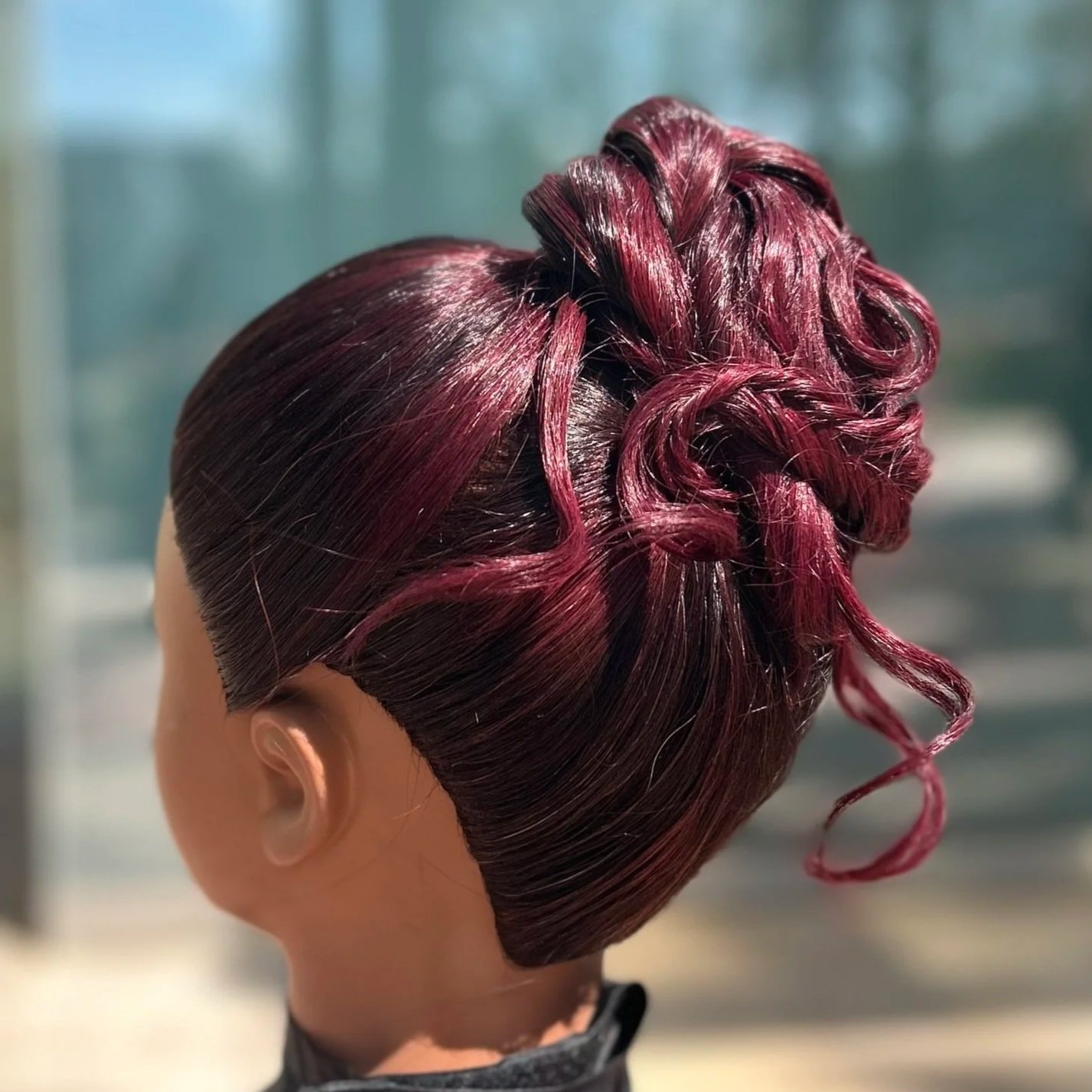 "Cherry Cola" red violet color and "messy bun" updo