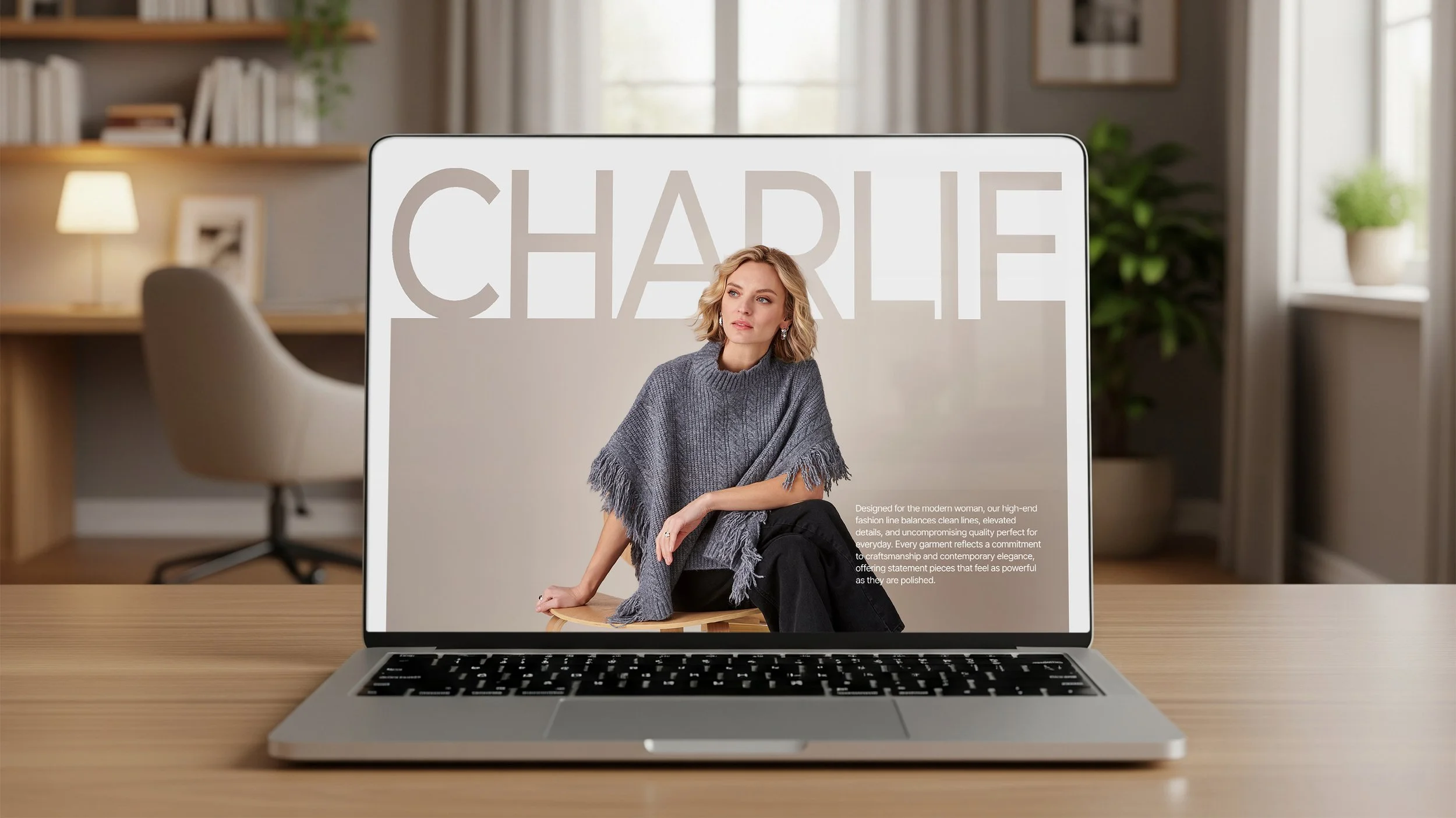Laptop on table showing Charlie Paige site with the word Charlie above a woman's head.