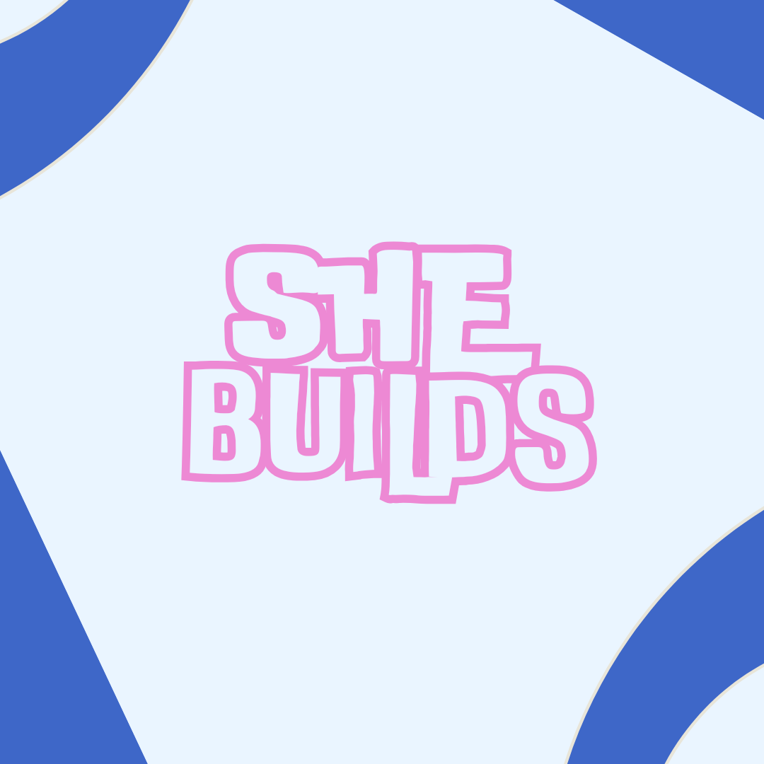 Colorful logo with the text "She Builds" in pink and white outlined letters on a light blue background with dark blue accents.