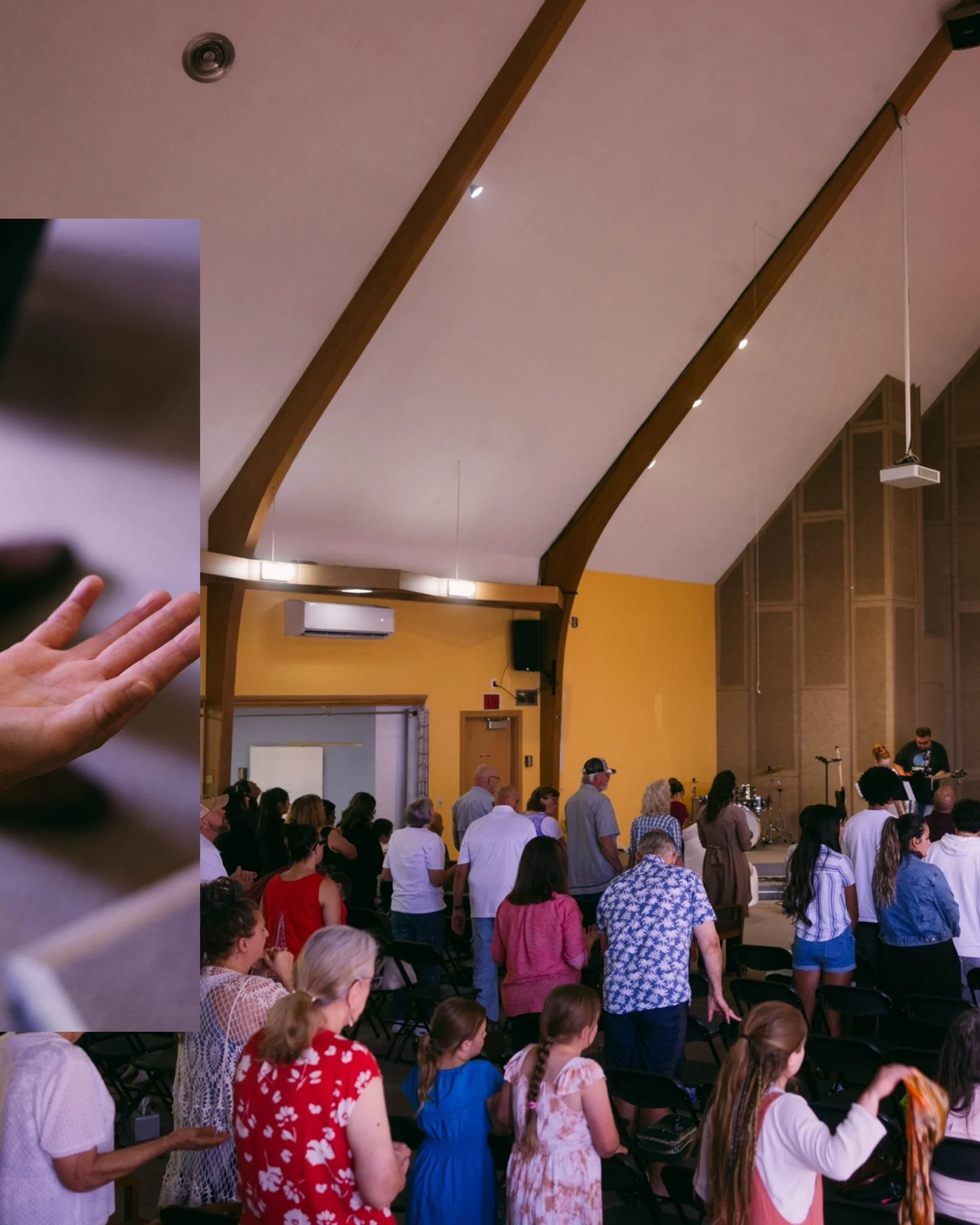 A group of individuals worshiping together at Sunday Service.
