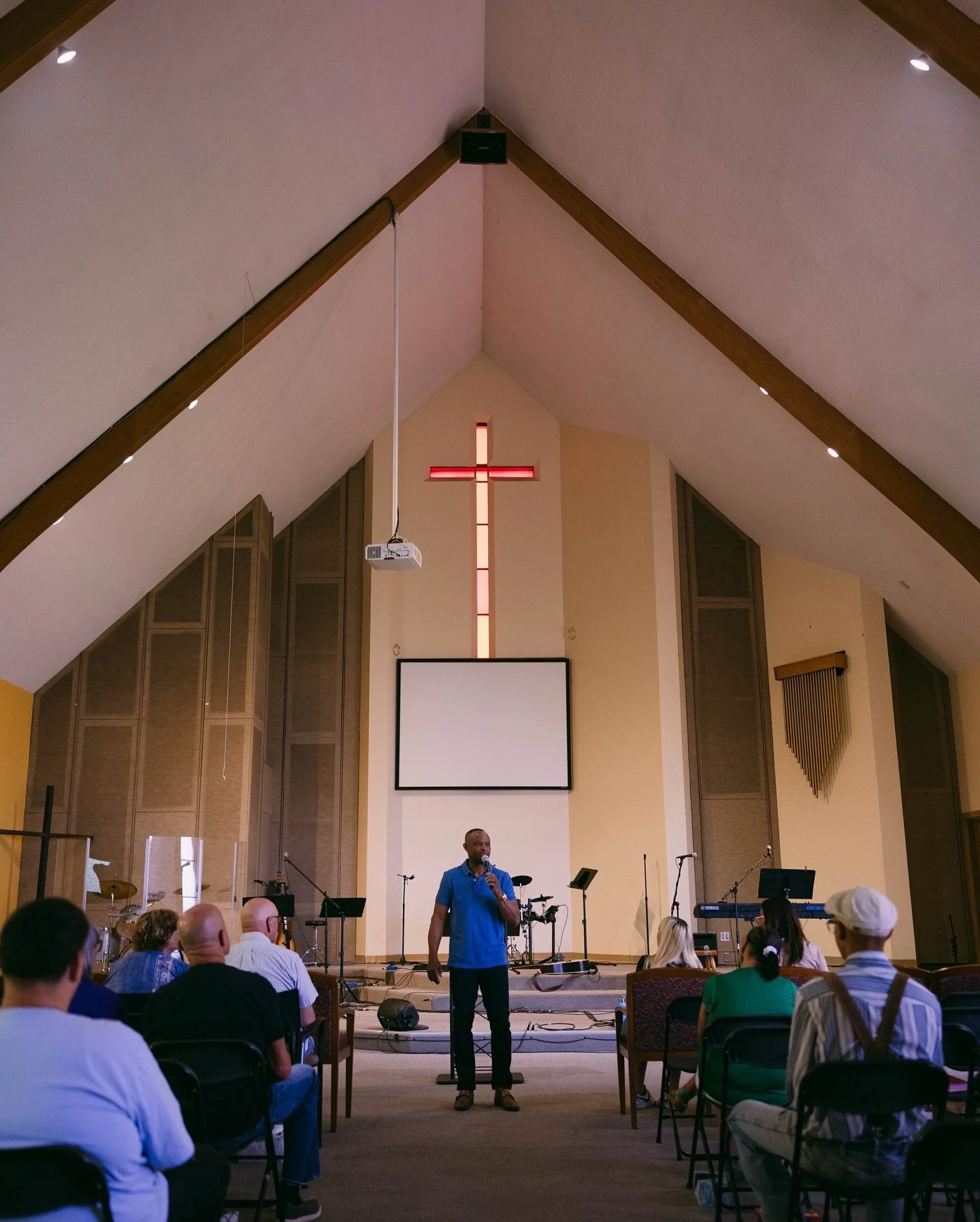 A group of individuals gathering at Sunday Service.