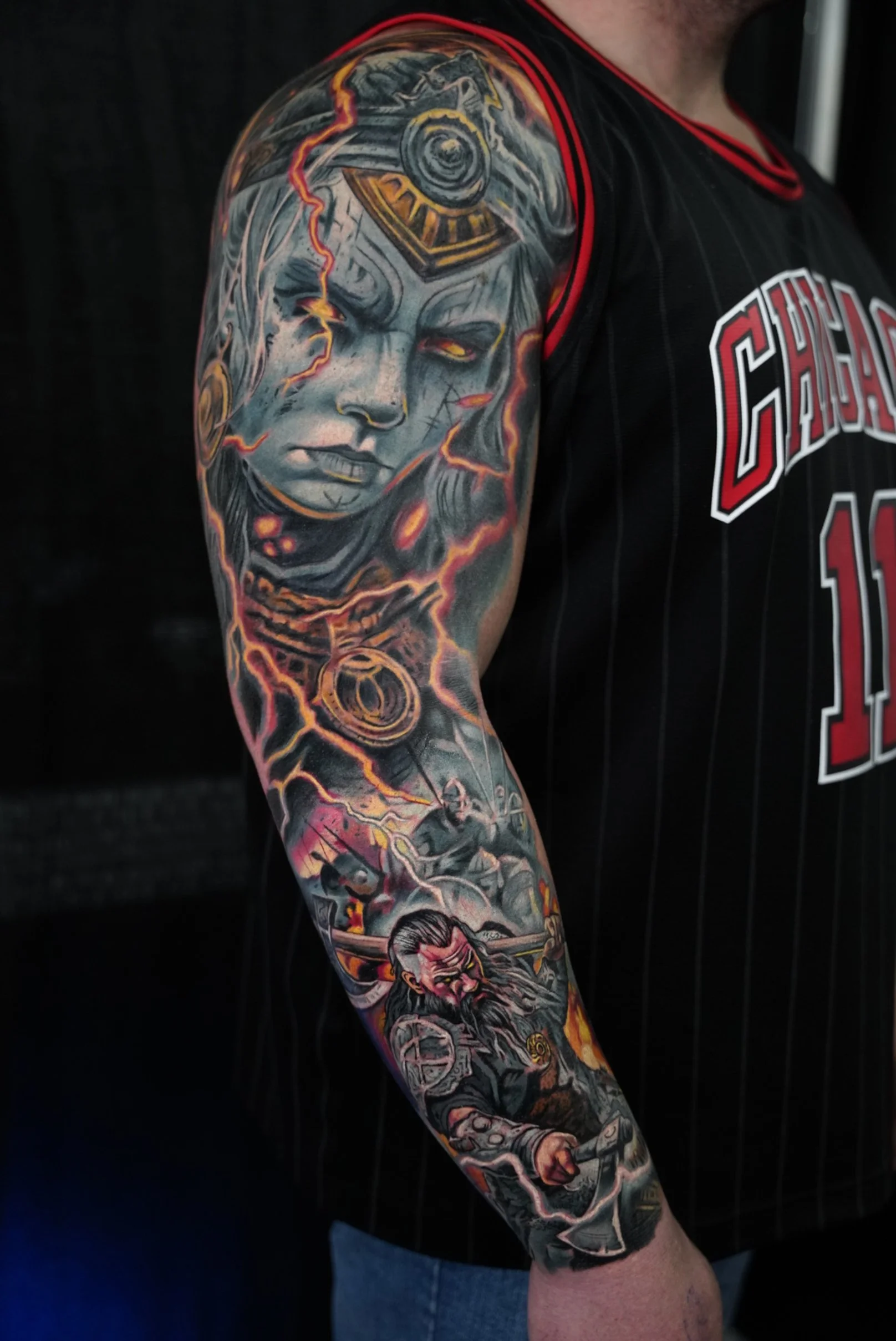 Custom cover-up sleeve section blending portrait realism with mythological storytelling. Strong facial expression, layered textures, and dynamic movement to rebuild the arm from scratch.