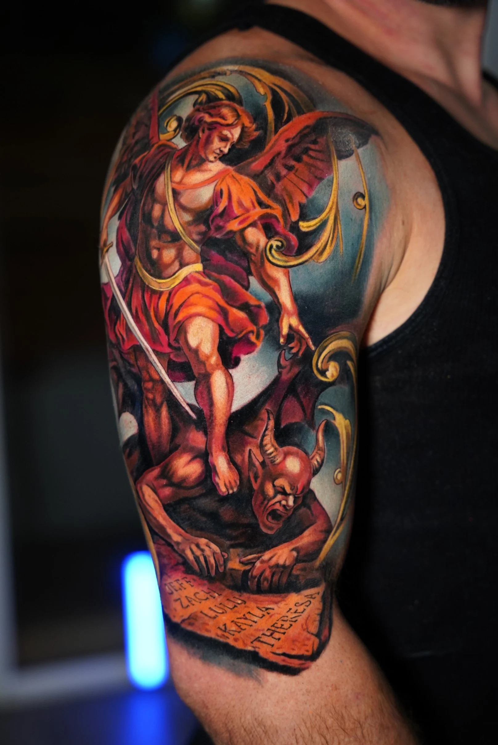 Color realism cover up tattoo of Archangel Saint Michael defeating a demon on the arm, completed in two consecutive sessions.