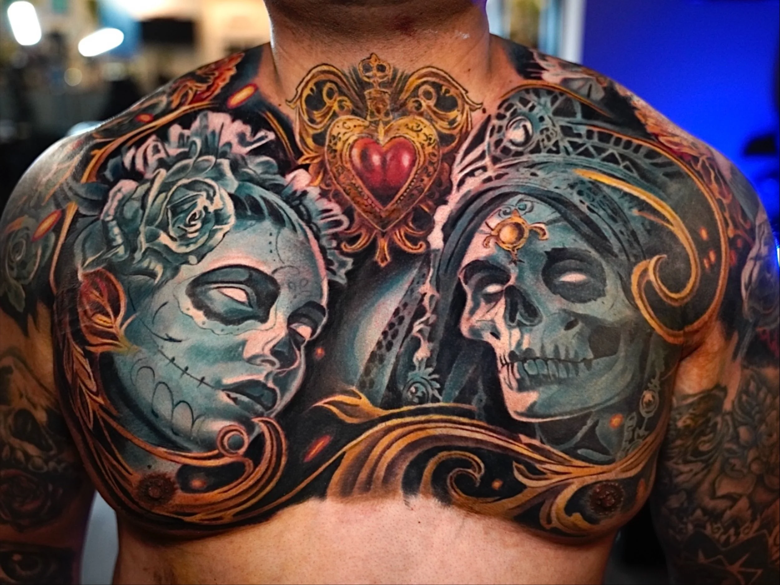 Cover up tattoo in progress on forearm and hand featuring dark reaper and skull design