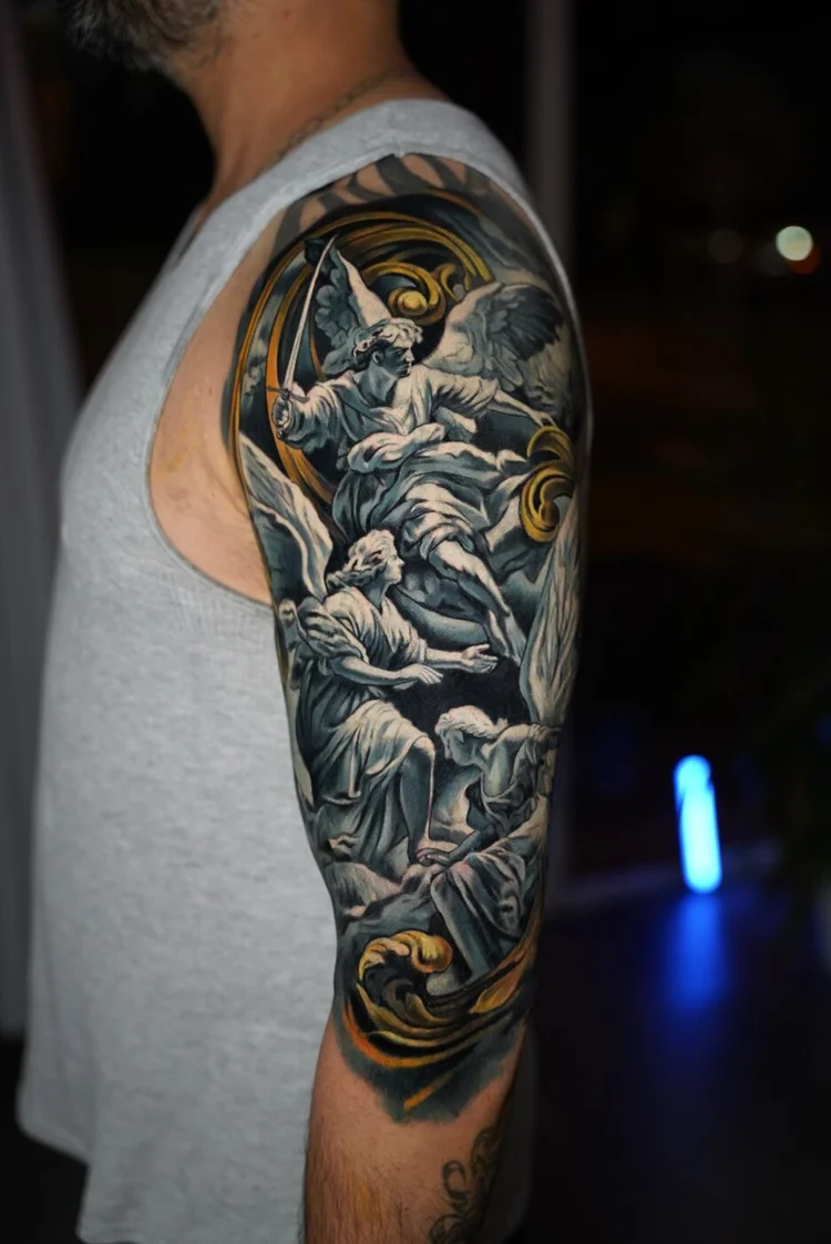 Angel upper-arm cover-up after session three, completing the second layer.