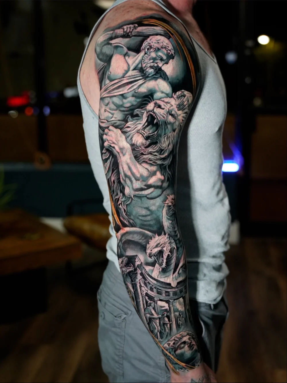Greek mythology cover-up sleeve with Hercules, a lion and classical architecture
