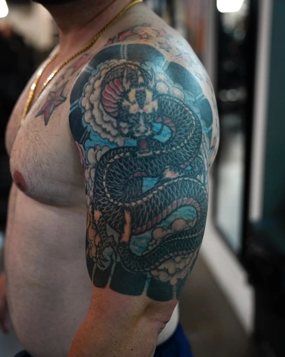 Original Japanese dragon tattoo on the upper arm before the cover-up