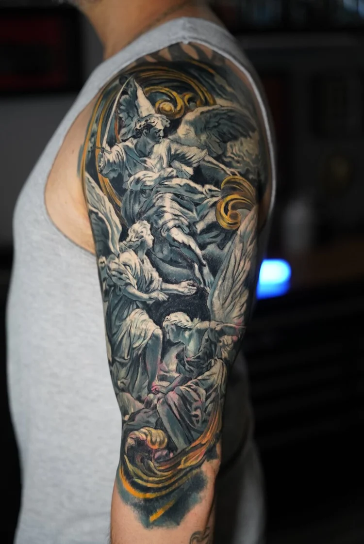 Healed first layer of the angel upper-arm cover-up before the final session.