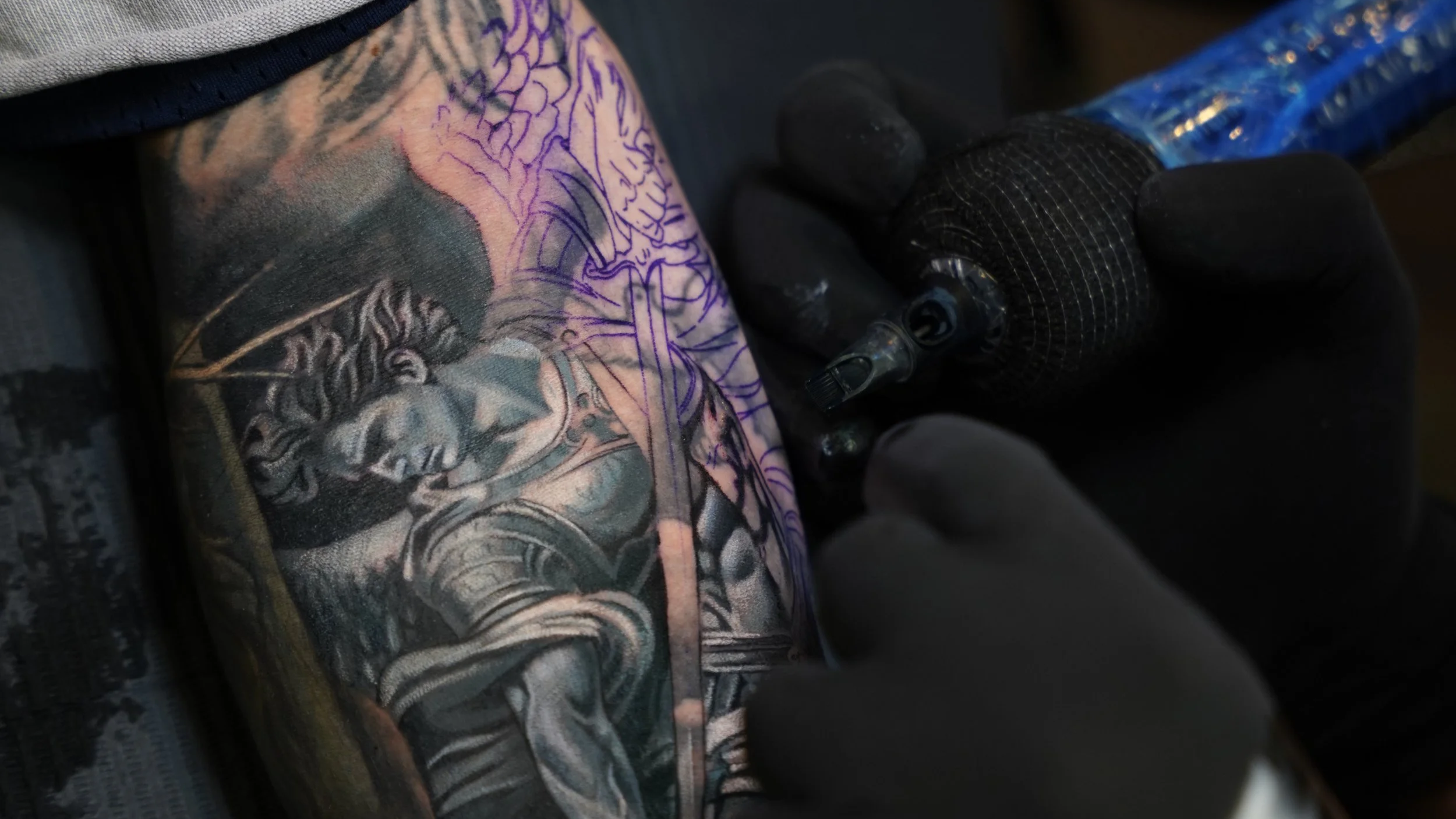 Close-up of a black and grey cover-up tattoo in progress at Black Nova Tattoo Collective in Miami, featuring detailed realism and custom tattoo work.