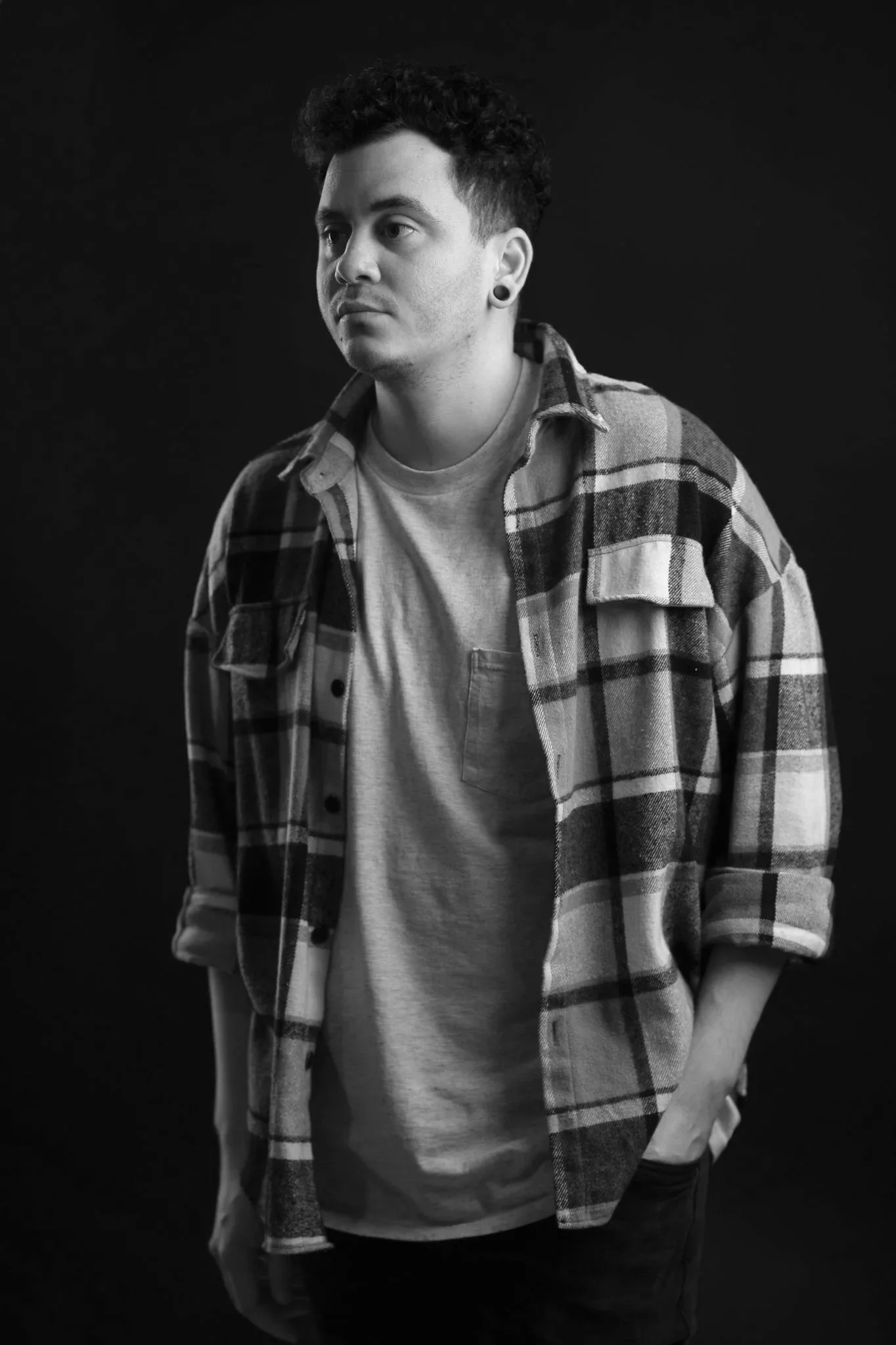 Portrait of a professional color cover up tattoo artist based in Miami, specializing in large-scale custom tattoo work.